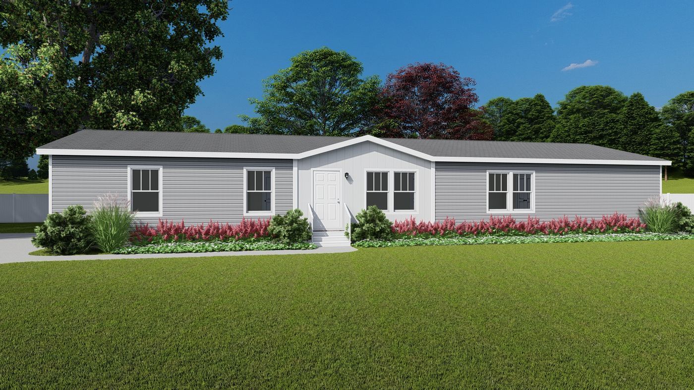 Light gray single-story home with white trim, a small porch, and manicured landscaping under a blue sky.