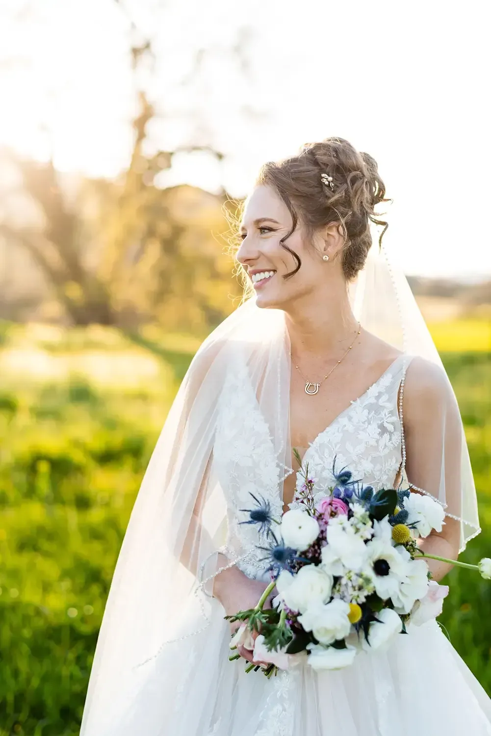 Bride with textured updo and soft glam makeup