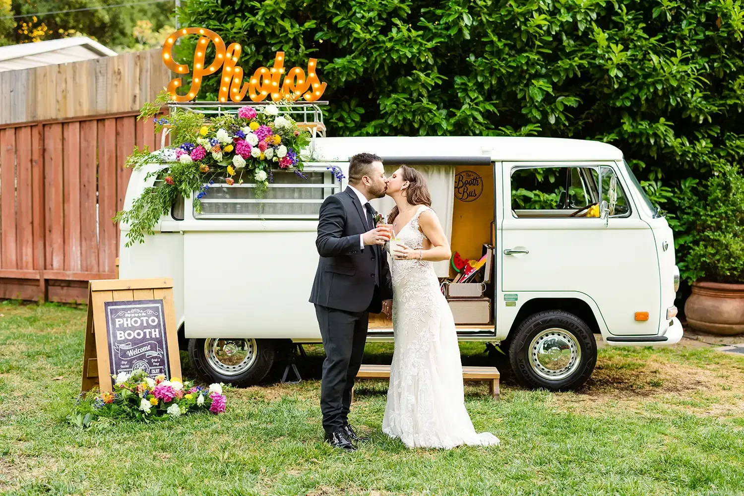 Romantic photo of bride and groom in front of a vintage van