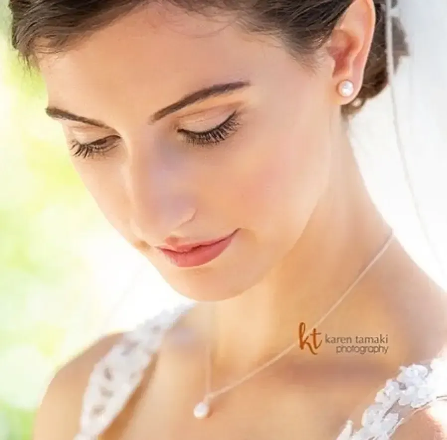 Classic bridal updo paired with natural makeup