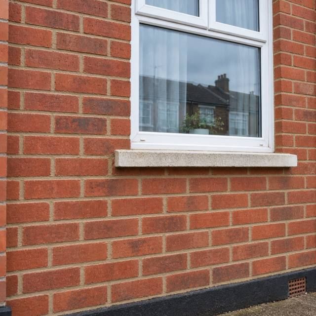 Brick house front repointing after