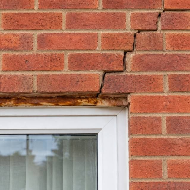 Brick wall over an opening repaired after lintel failure before