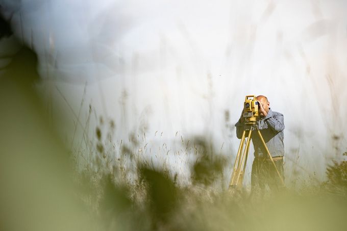 Surveyor using theodolite — Waynesboro, VA — Tom Shumate Surveyor Inc