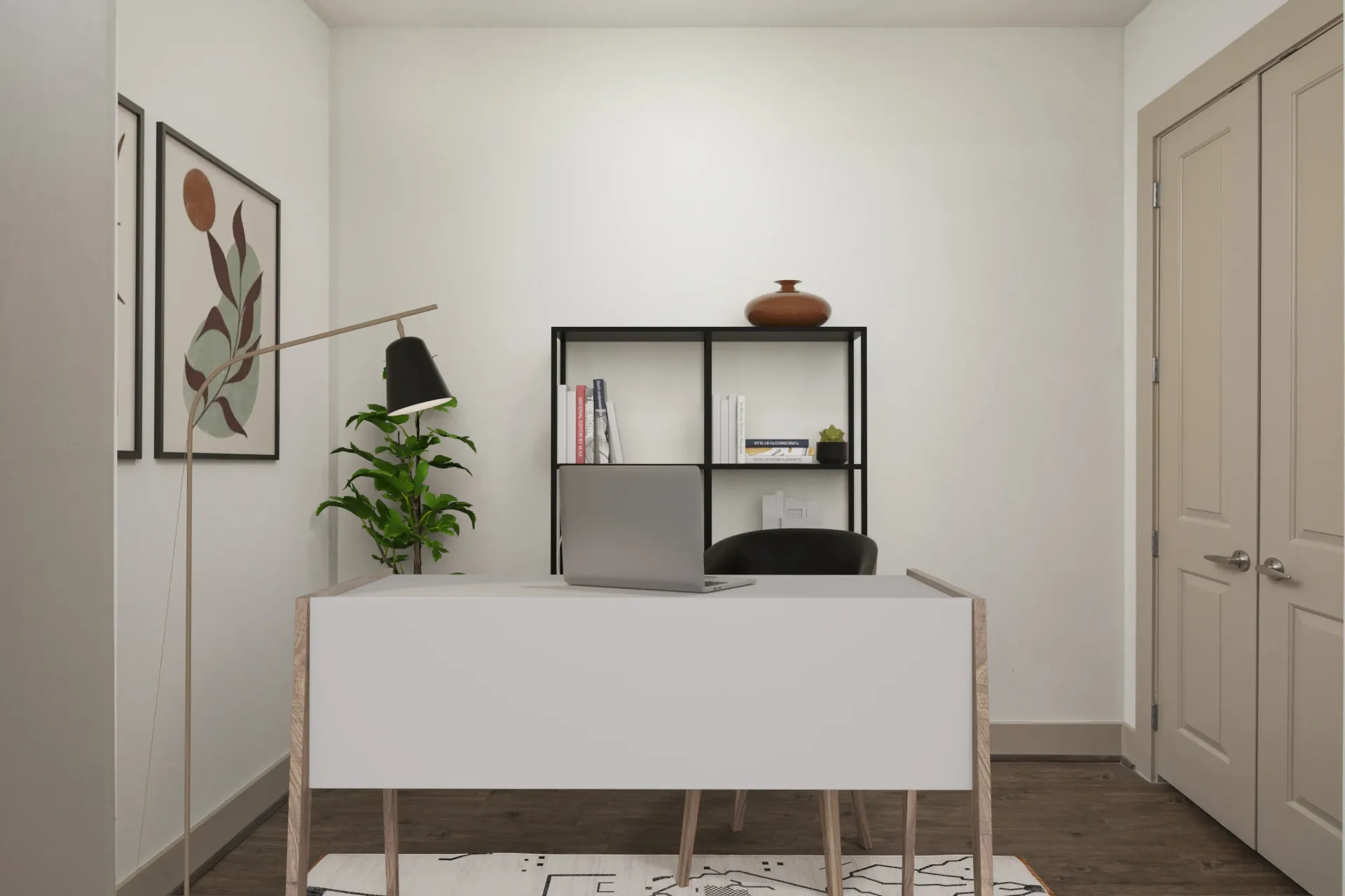 Modern home office setup with desk, plant, and shelf at Marquis Enclave, offers apartments and lofts in Midtown Houston, TX.
