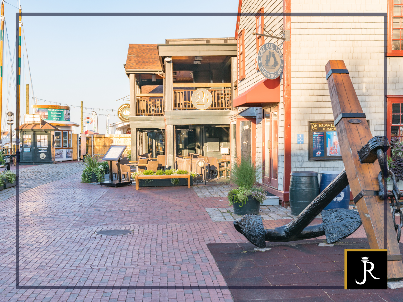 Waterfront Street in Newport Rhode Island, with cobblestone walkways, seaside shops, and restaurants
