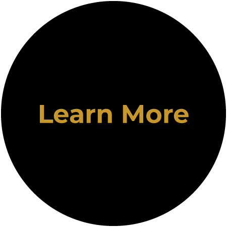 Black circular button with gold “Learn More” text