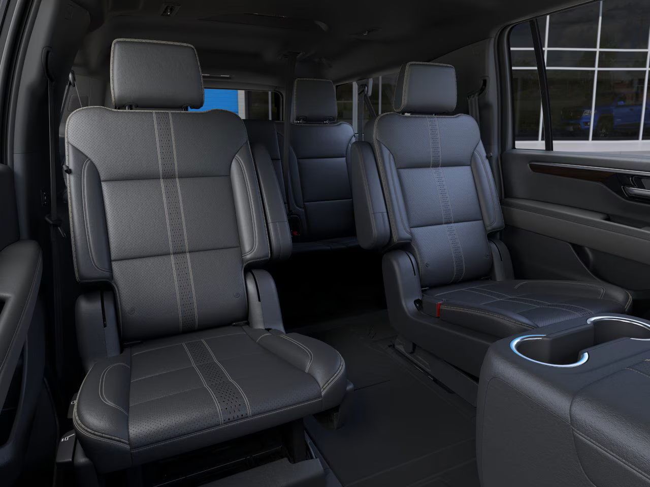 Black leather car interior with two front captain's seats and a center console