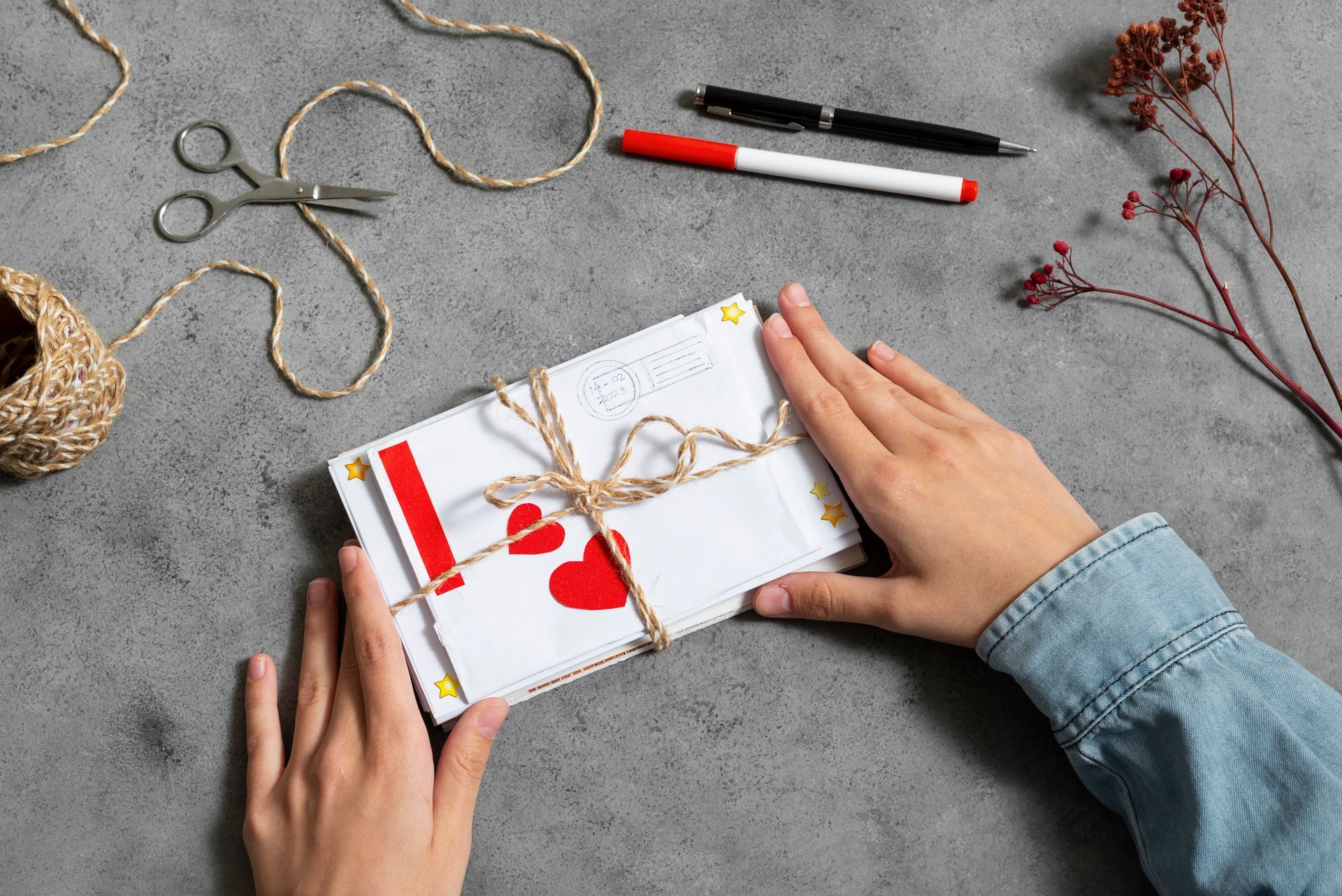 A person is holding an envelope with a canadian flag on it.
