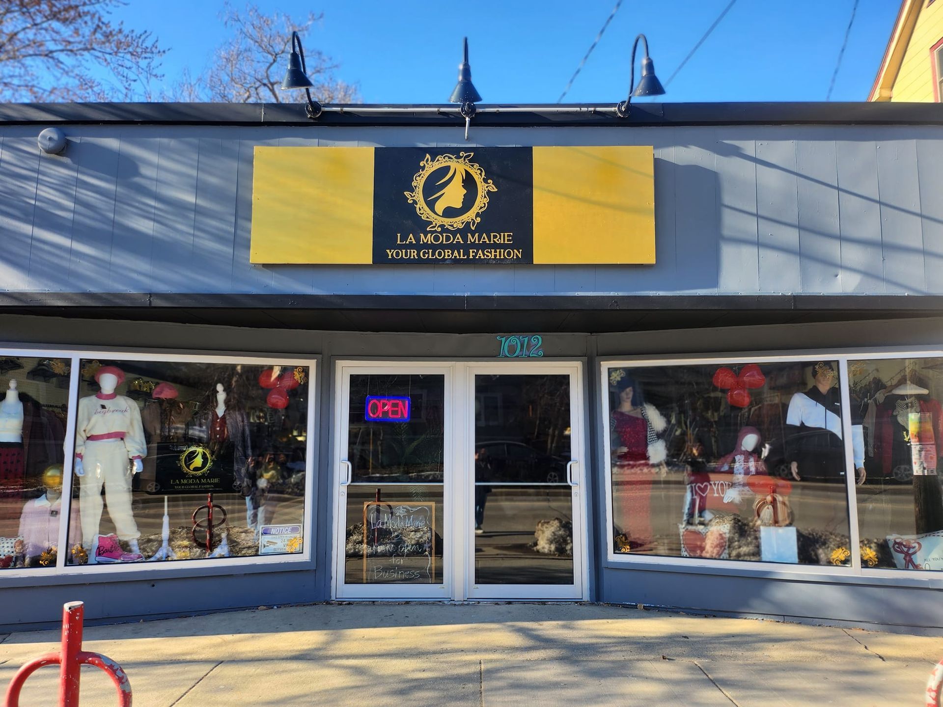 A store front with a sign that says `` open '' on it.