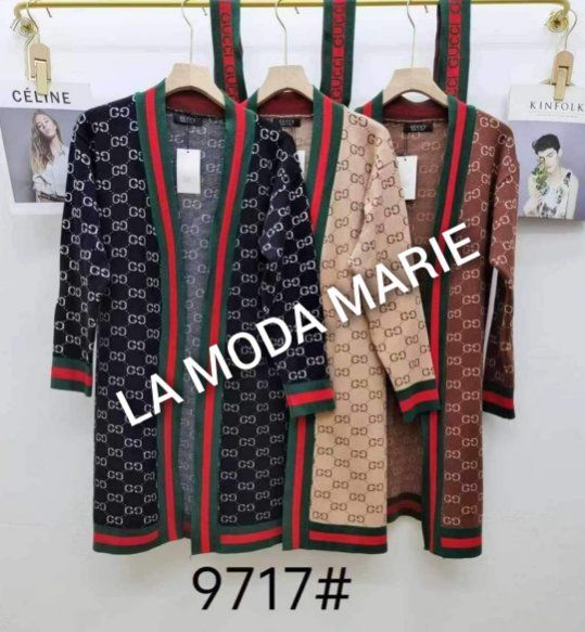 A row of la moda marie sweaters hanging on a rack