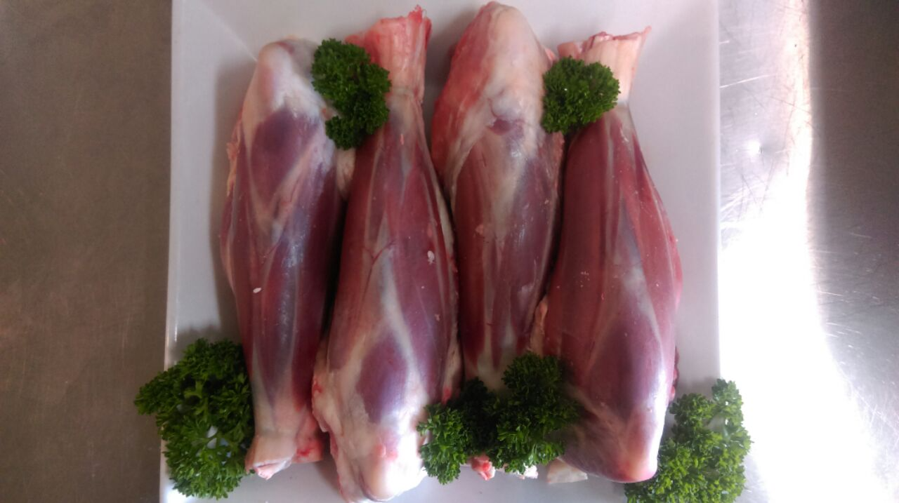 Four Raw Lamb Shanks on a White Plate — Drovers Meats in Coffs Harbour, NSW
