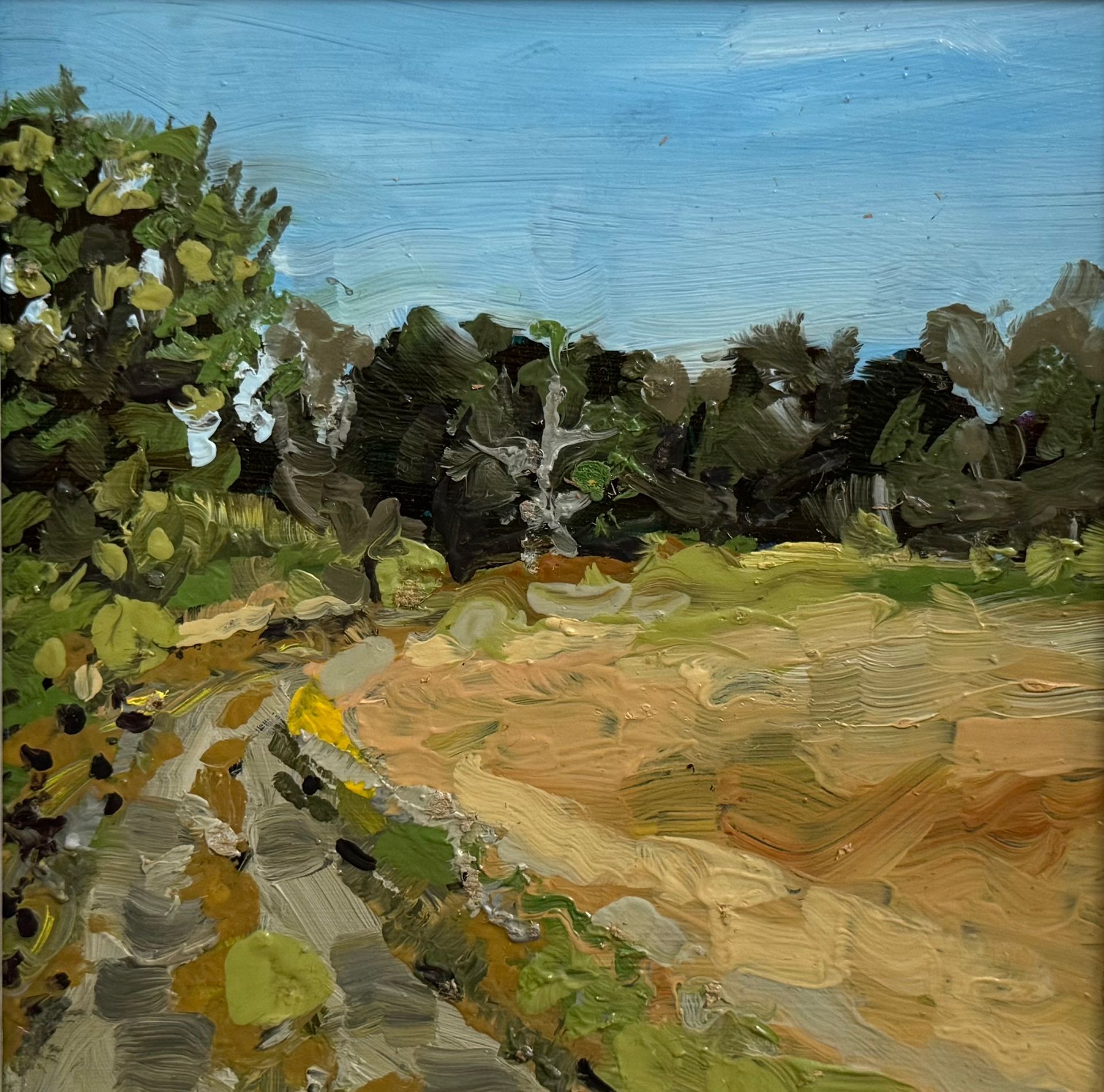 Oil painting of a sunny rural path beside a golden field and trees under a blue sky