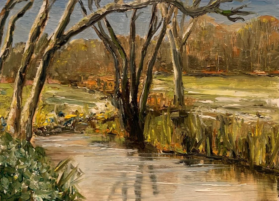 Impressionist landscape of a marshy stream with bare trees, reeds, and warm autumn foliage