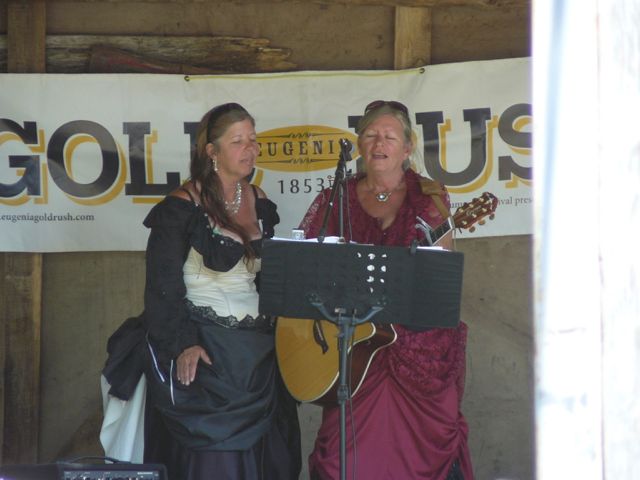 Singers dressed in period costumes.