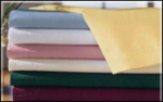 A pile of sheets of different colors are stacked on top of each other.