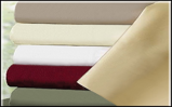 A pile of sheets of different colors are stacked on top of each other.