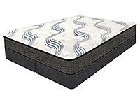 A mattress is sitting on top of a bed on a white background.