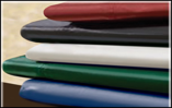 A stack of plastic bags of different colors are stacked on top of each other.