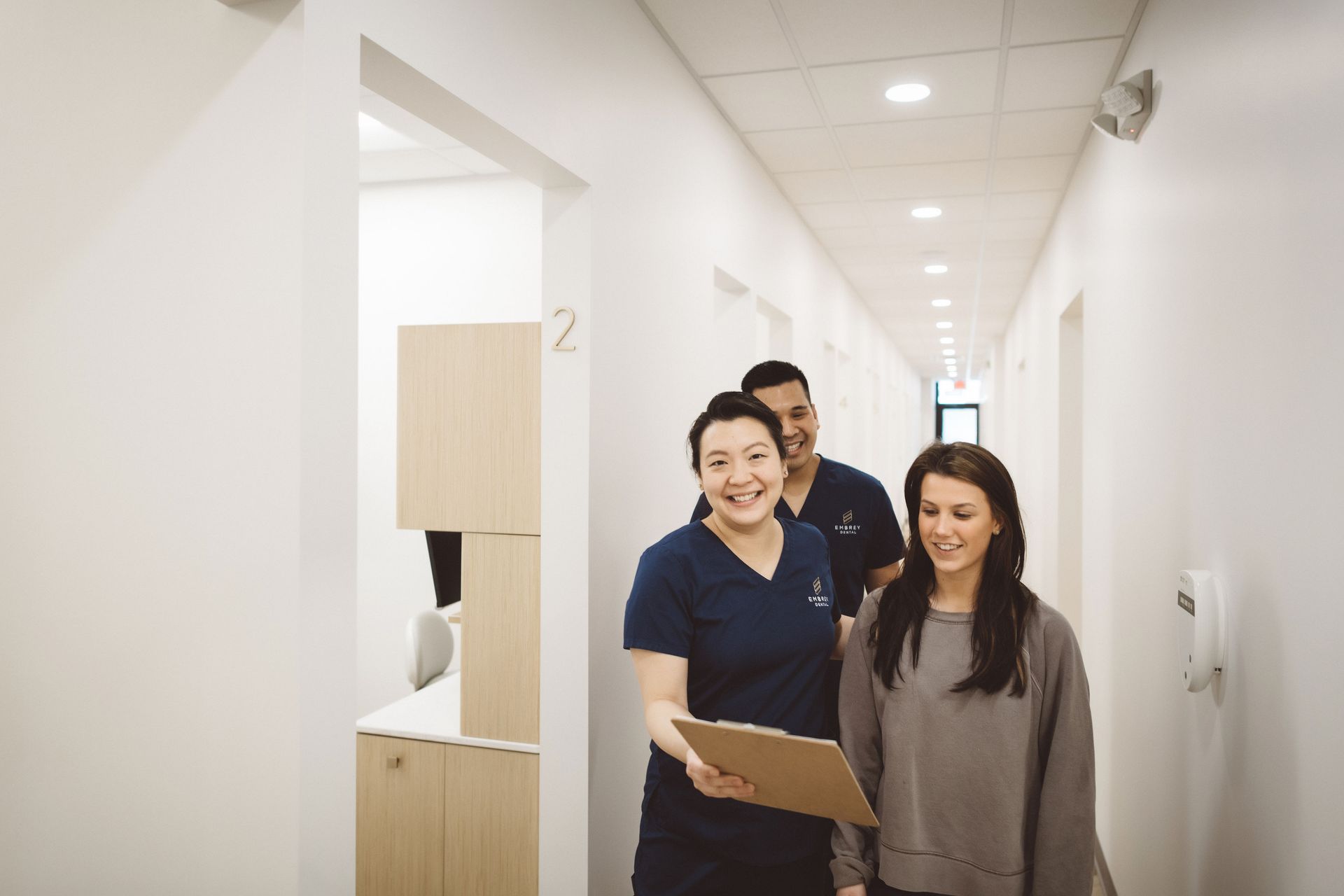 office manager Rose walking with a patient while they go to an observatory