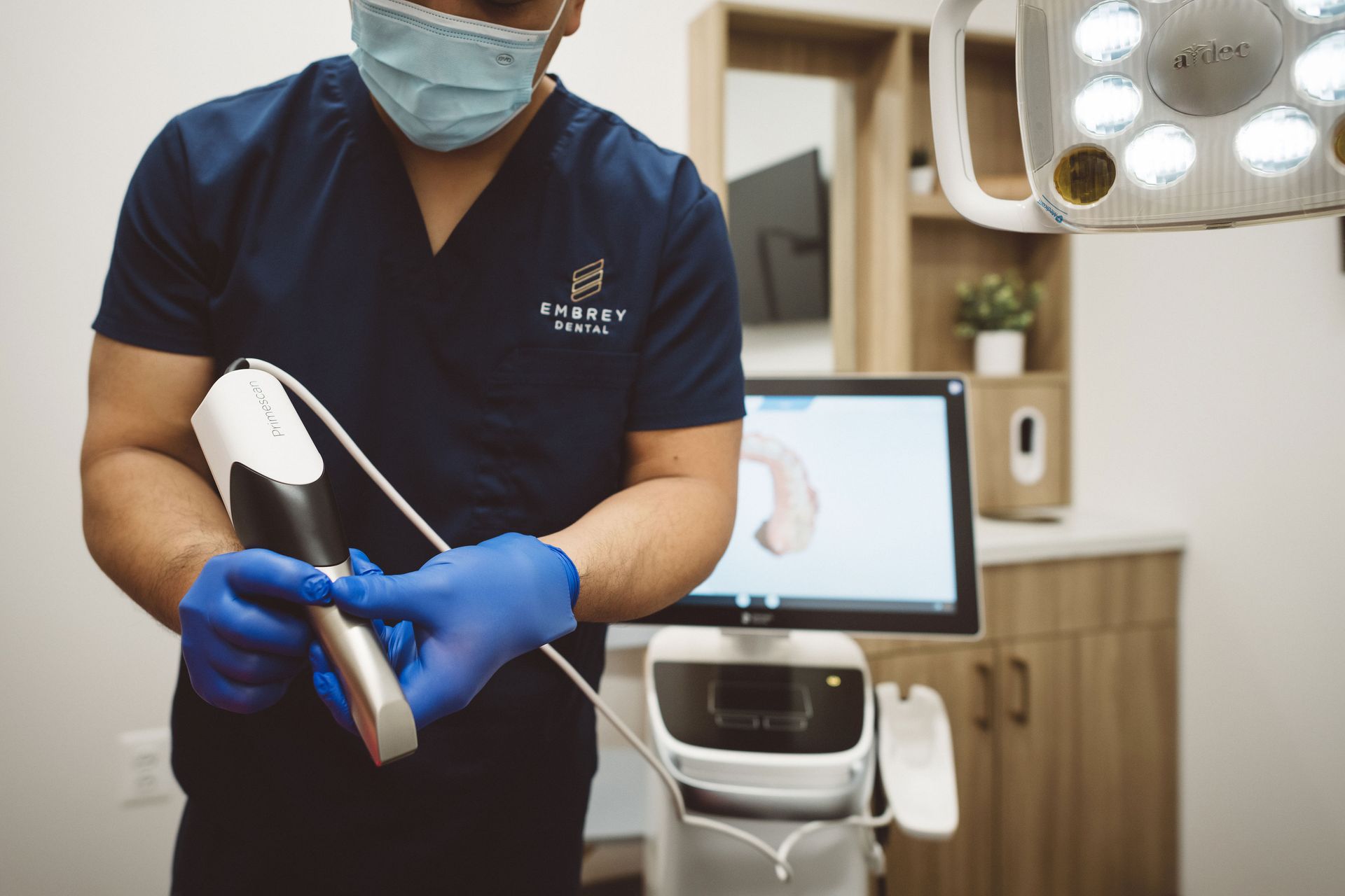 dr lim showing their dental scanner for 3d imaging
