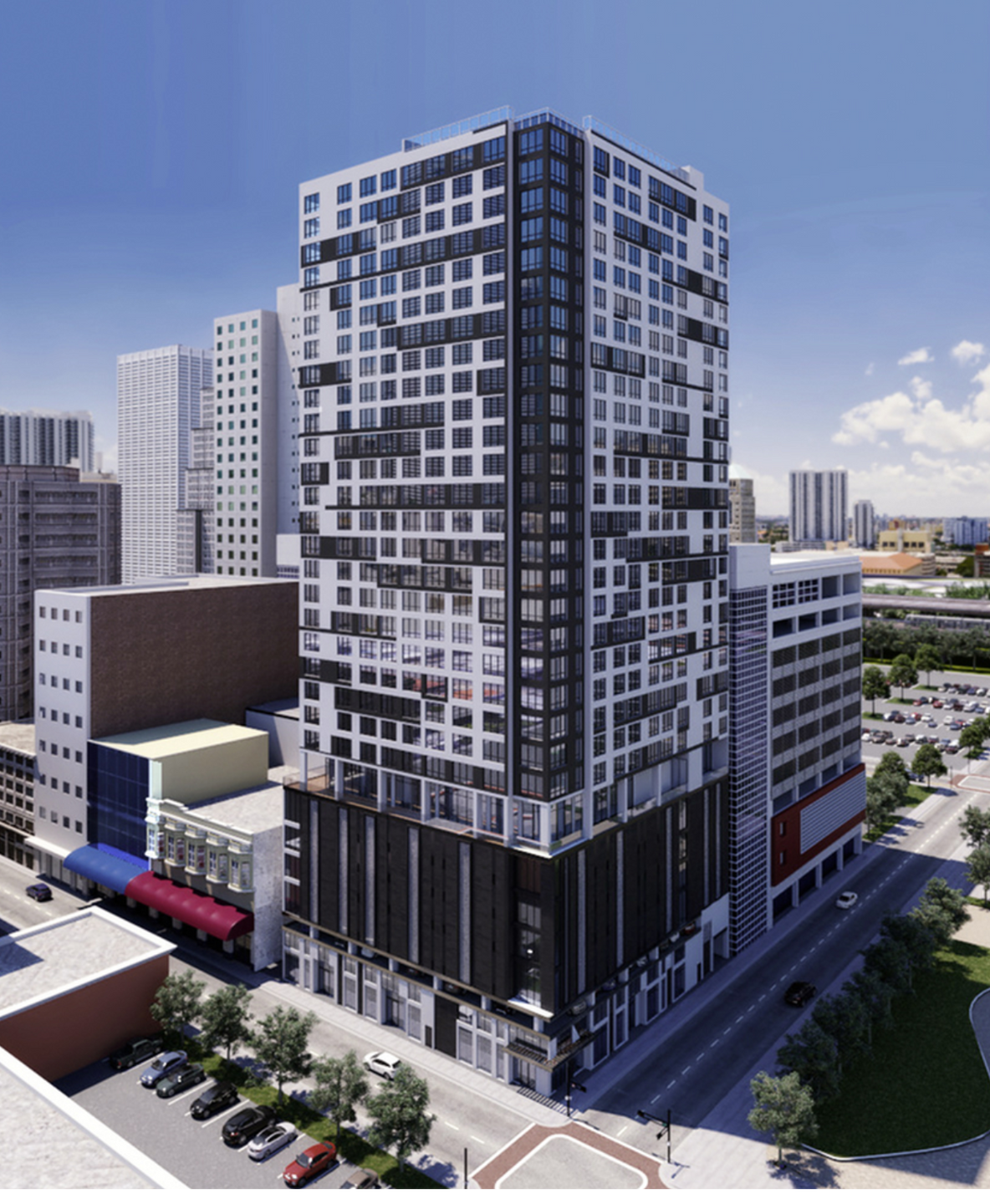 Exterior view of a tall modern apartment building with a glass and concrete façade along a city street.