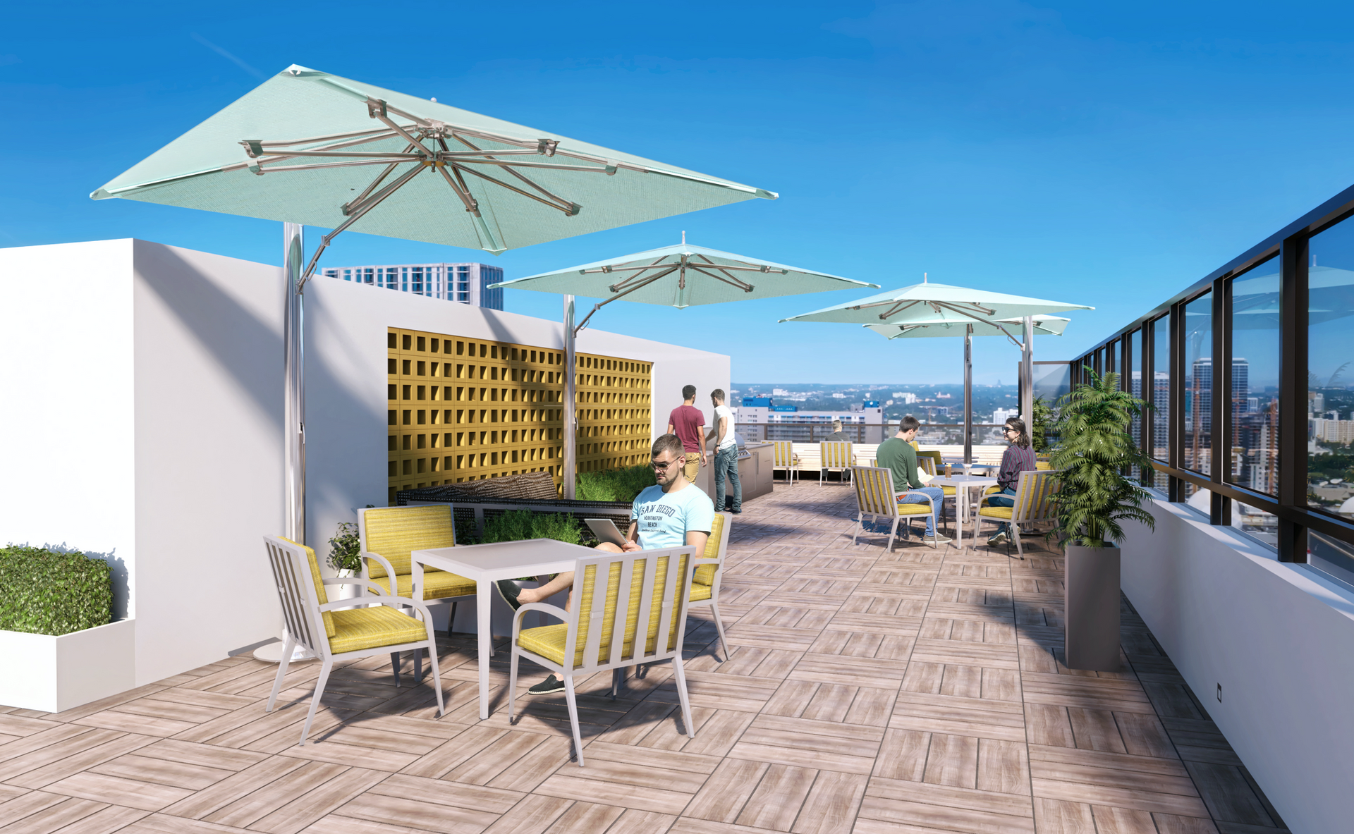 Rooftop terrace with large umbrellas, tables and chairs, and people enjoying skyline views.