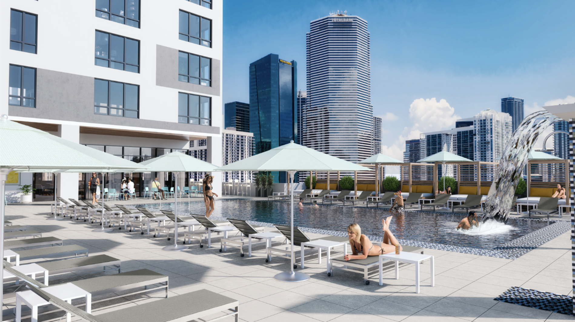 Rooftop pool deck with lounge chairs, umbrellas, and a city skyline.