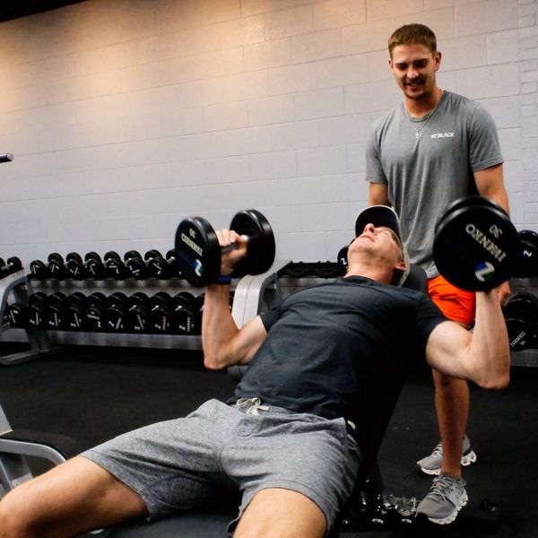 Personal trainer Logan working with a client at Fitness at KT Black private studio in Amarillo, TX