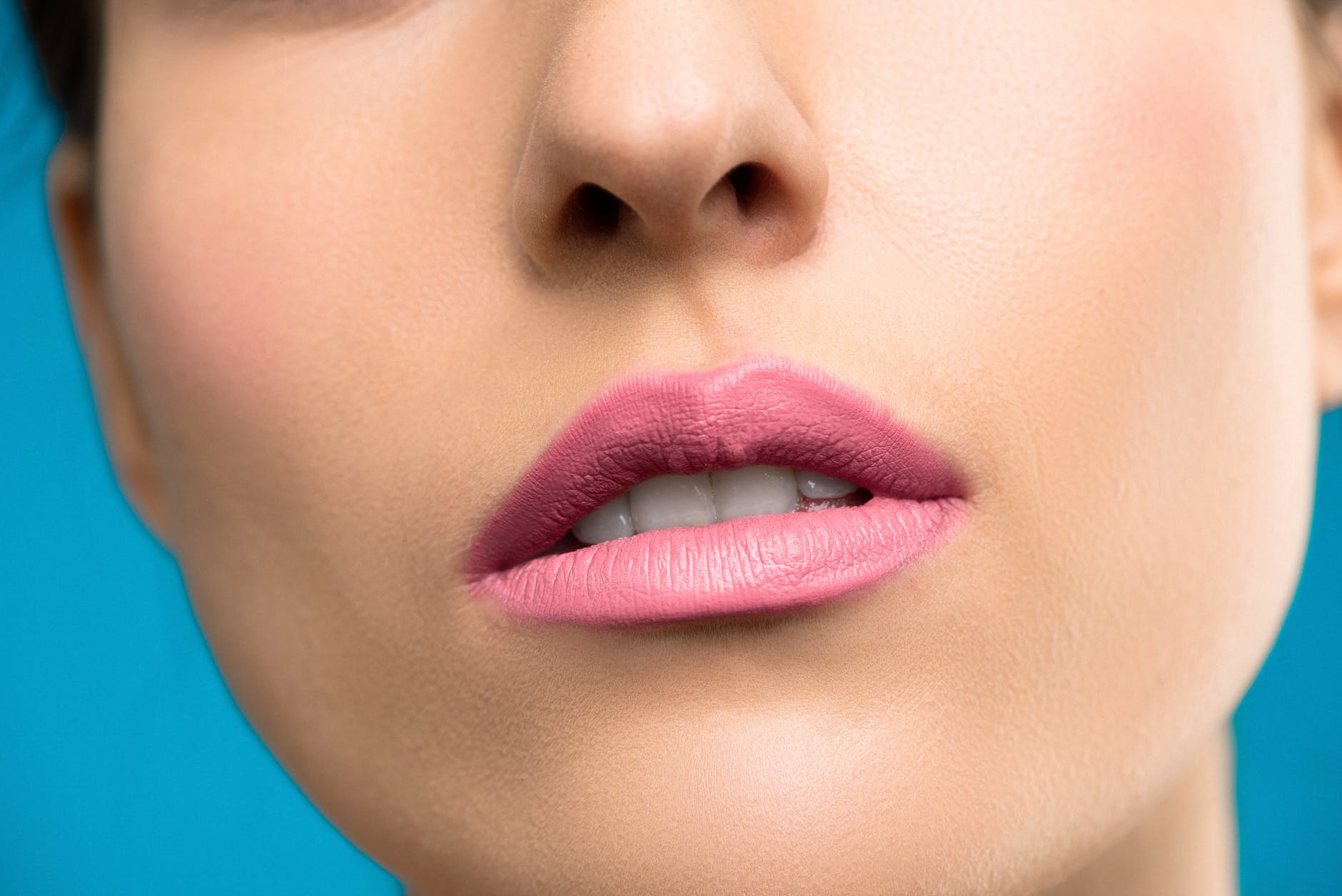 model with long dark hair and full lips