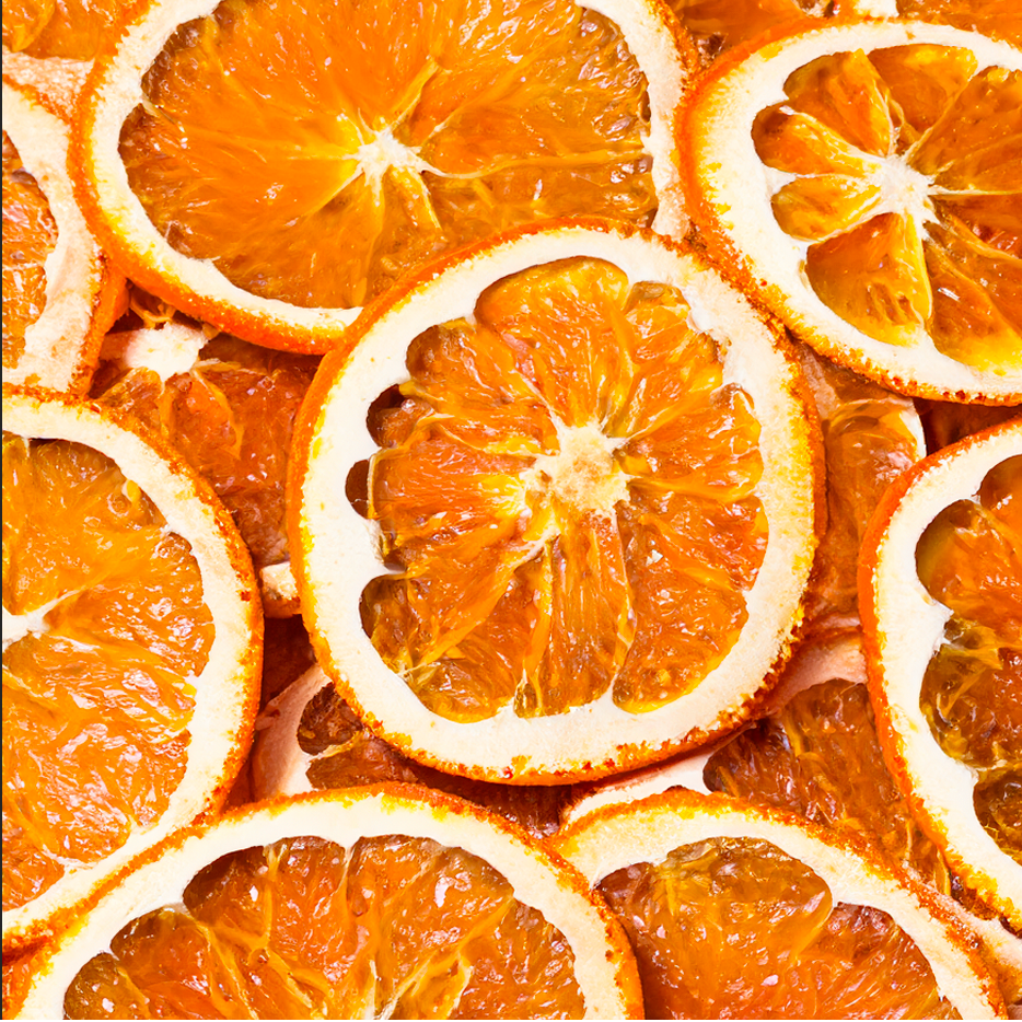 A pile of sliced oranges on a table