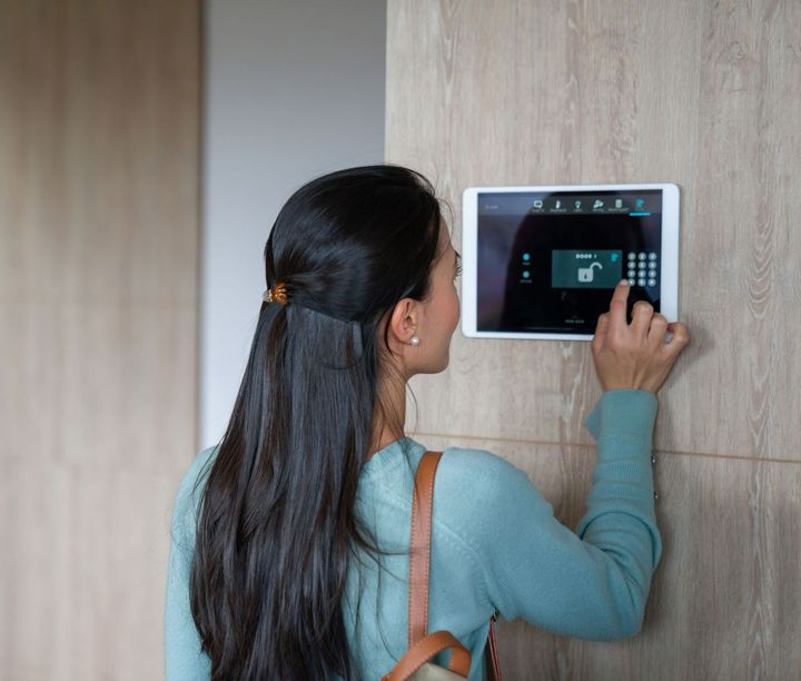 Woman entering pin to lock the door | Sydney, NSW | TEC Security