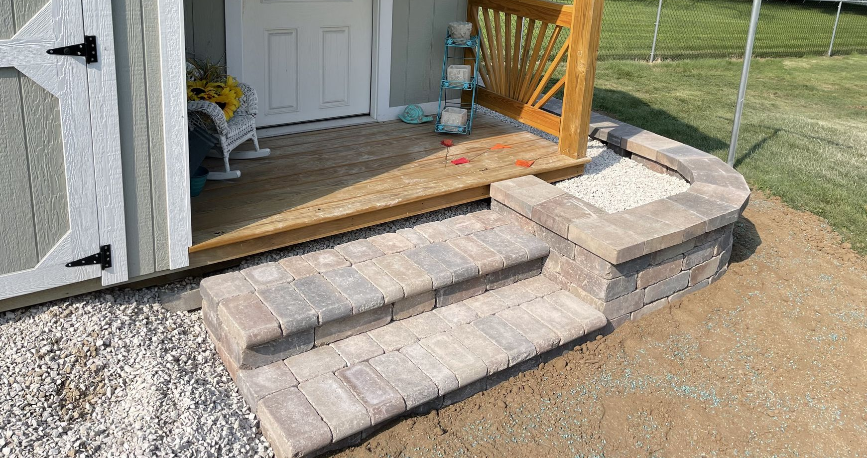 Stone paver patio with steps and raised planter near Fond du Lac, WI
