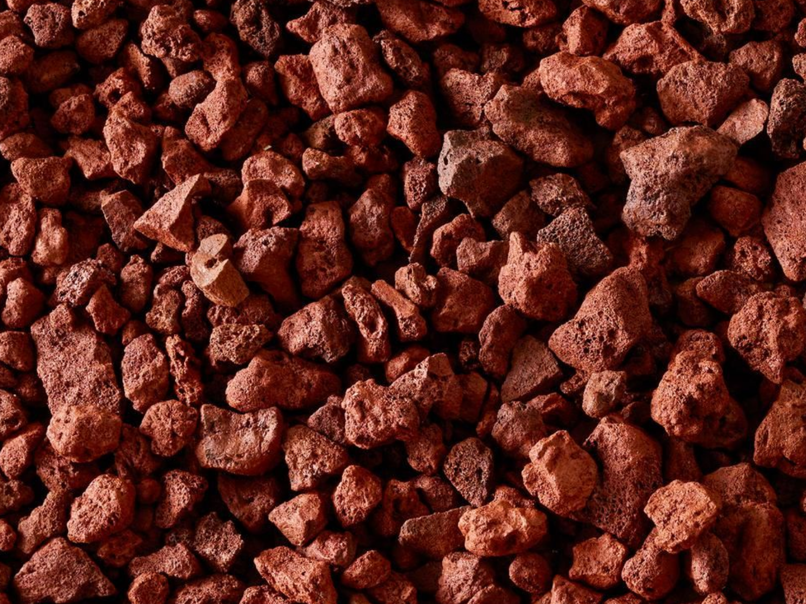 Close-up of small reddish-brown gravel stones filling the frame