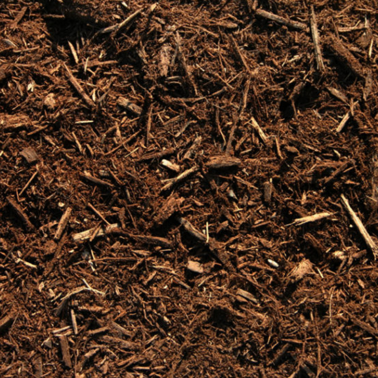 Brown wood chip mulch with rough, shredded bark texture