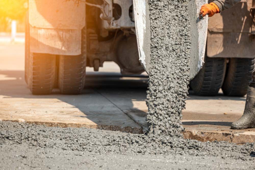 Pouring Ready-Mixed Concrete After Placing Steel Reinforcement — Ingham Concrete–Icon in Cardwell, QLD