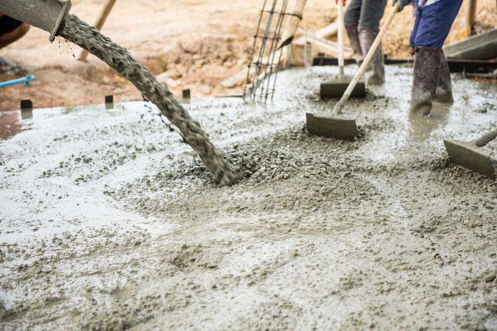 Concrete pouring during commercial concreting floors of buildings — Ingham Concrete–Icon in Ingham, QLD