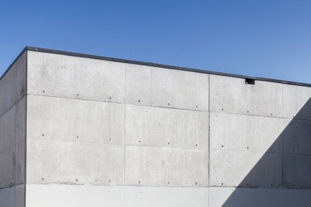 A Close Up Of A Concrete Wall With A Blue Sky In The Background — Ingham Concrete–Icon in Ingham, QLD