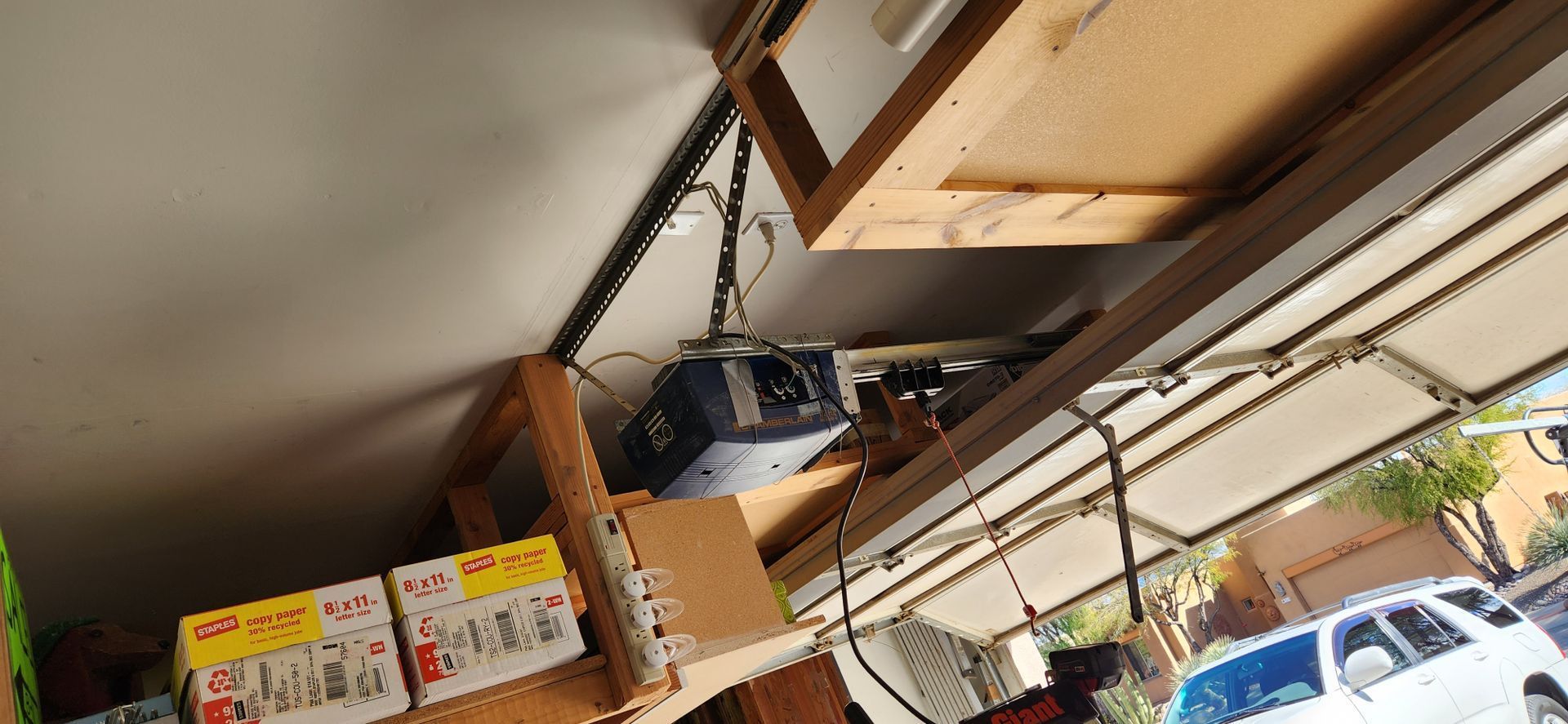 A garage with a lot of shelves and boxes on it.