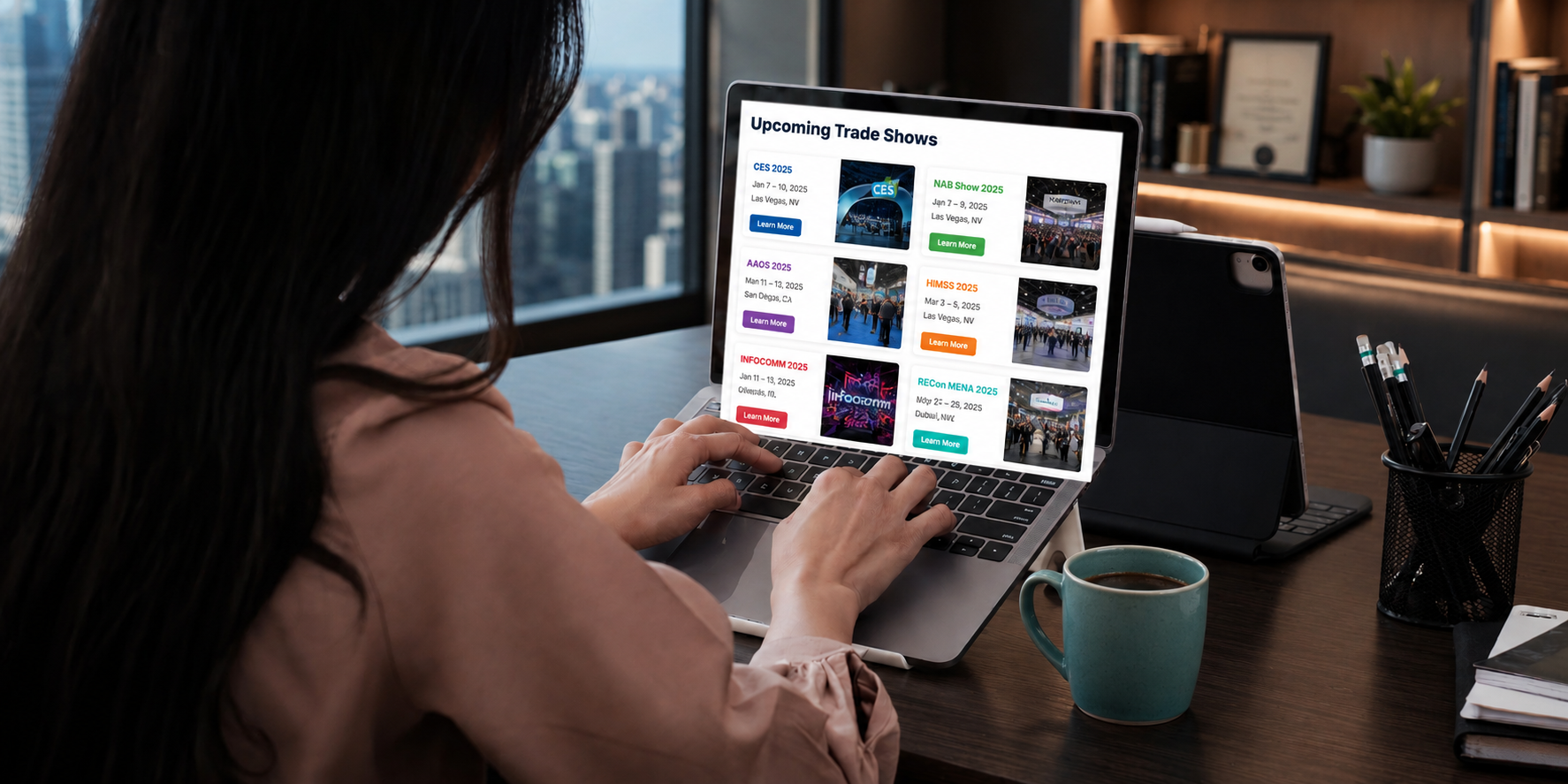 Person browsing a grid of colorful apparel on a laptop while seated indoors