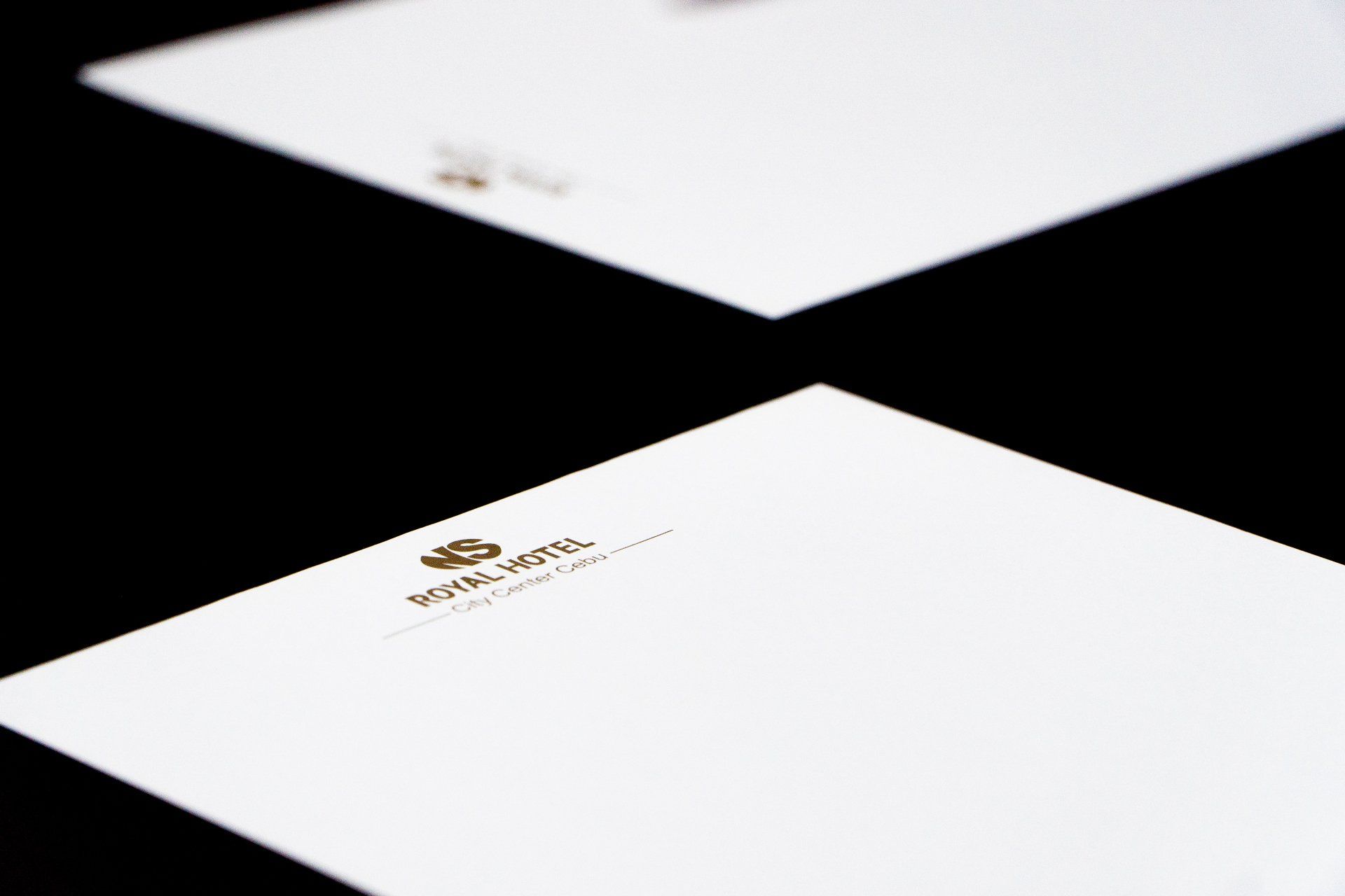 A close up of four pieces of paper on a table.