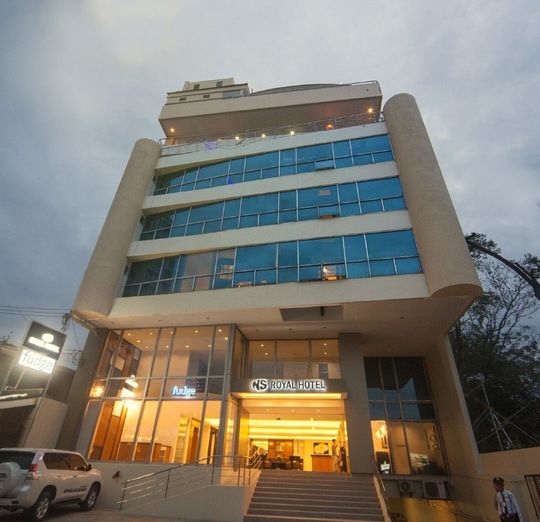 A large building with a sign that says ' hotel ' on it