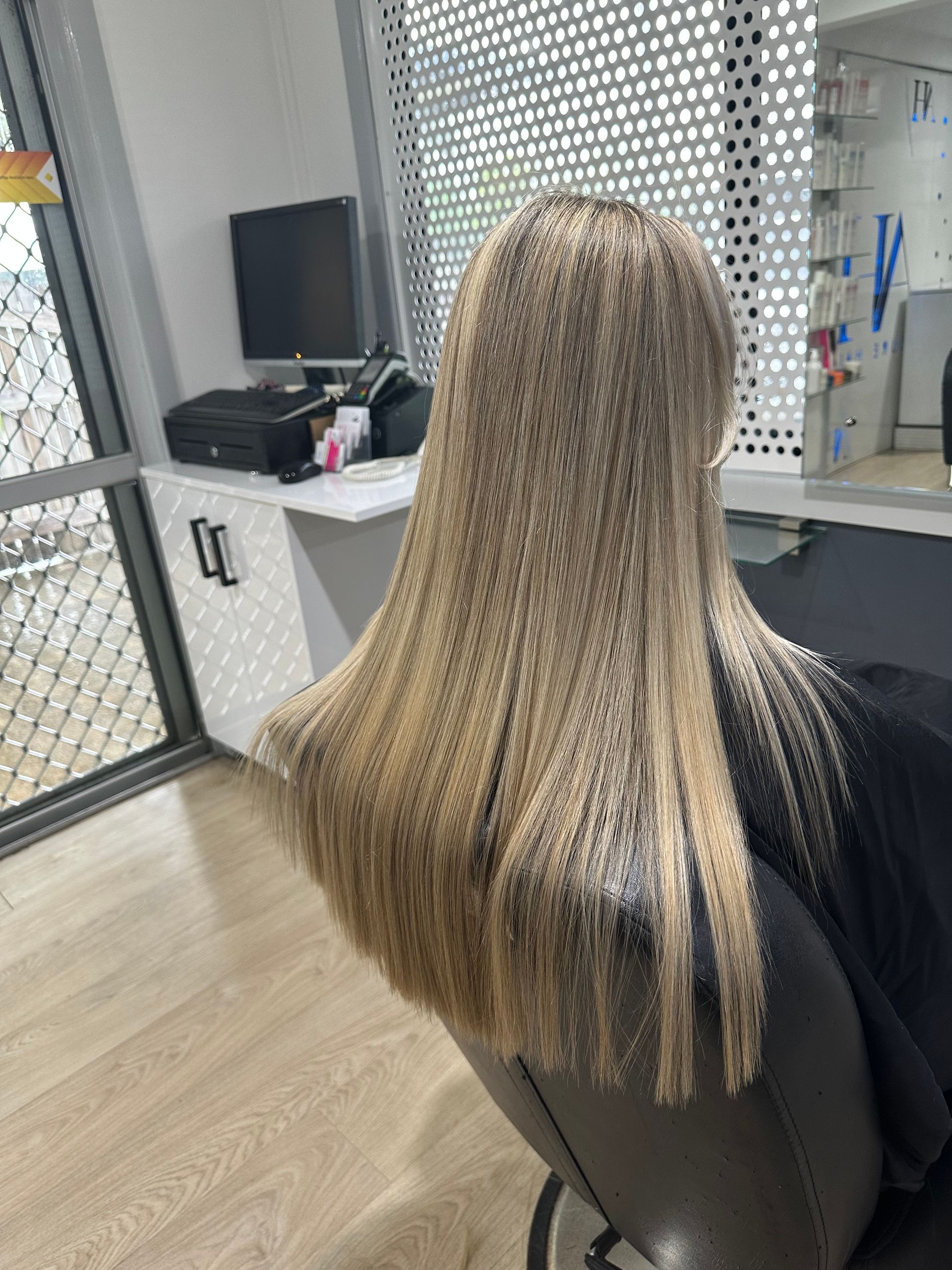 A Woman is Getting Her Hair Dyed in a Salon — Azure Hair in South Mackay, QLD