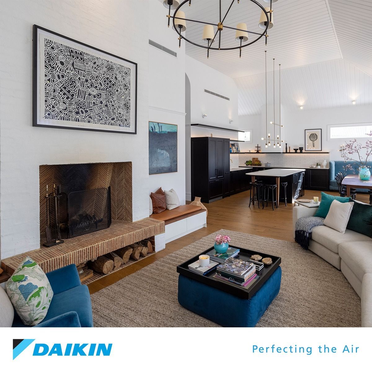 An Empty Living Room With a Couch, Table and Chairs — Revive Air Conditioning in Camden, NSW