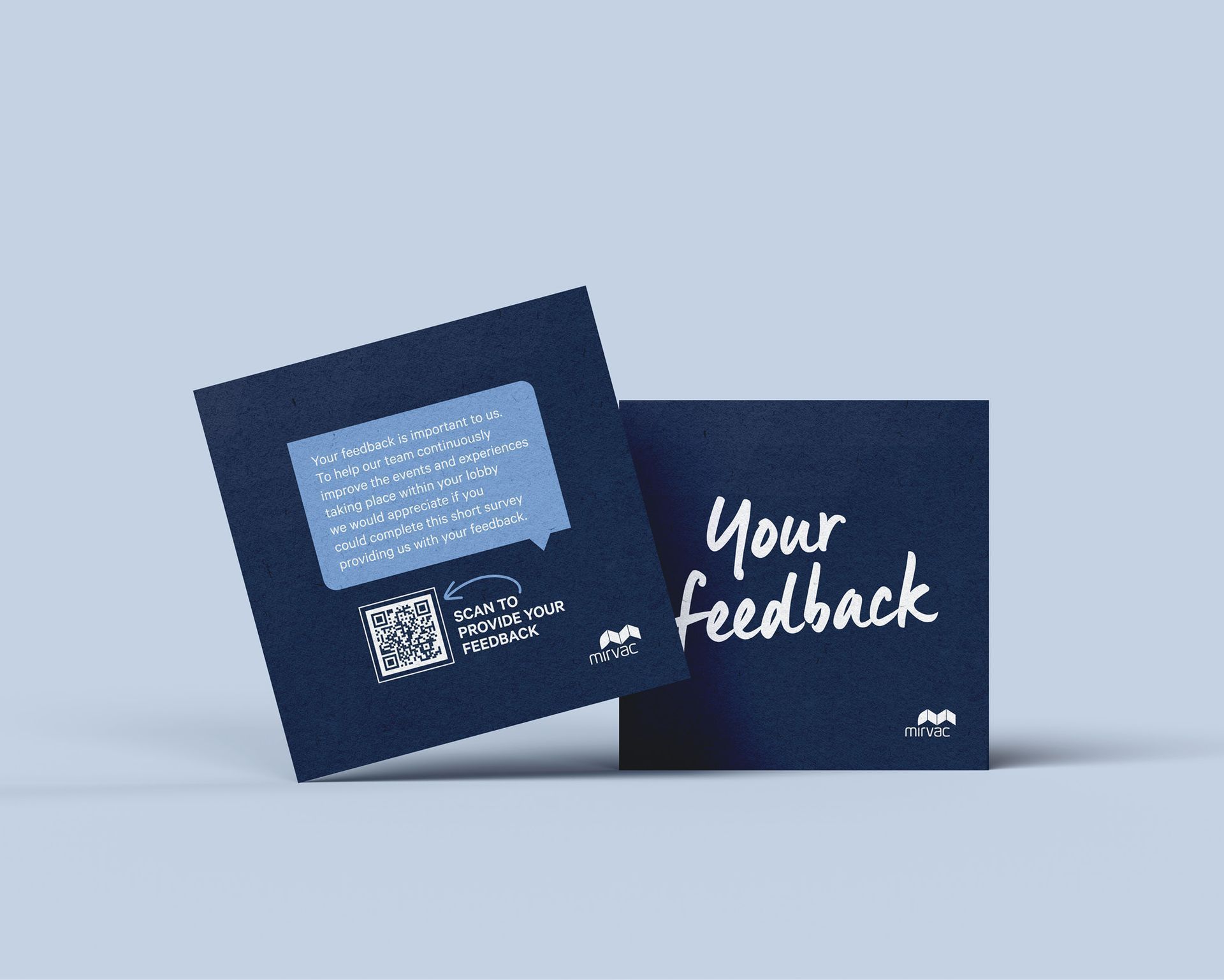 Two dark blue feedback cards, one angled with a QR code and one reading “Your feedback.”