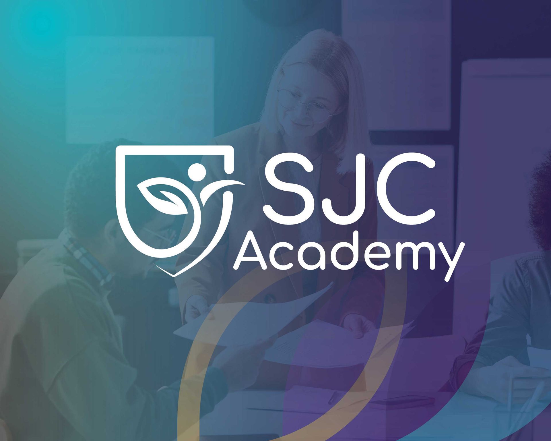 SJC Academy logo over blurred blue and purple background with people in the classroom
