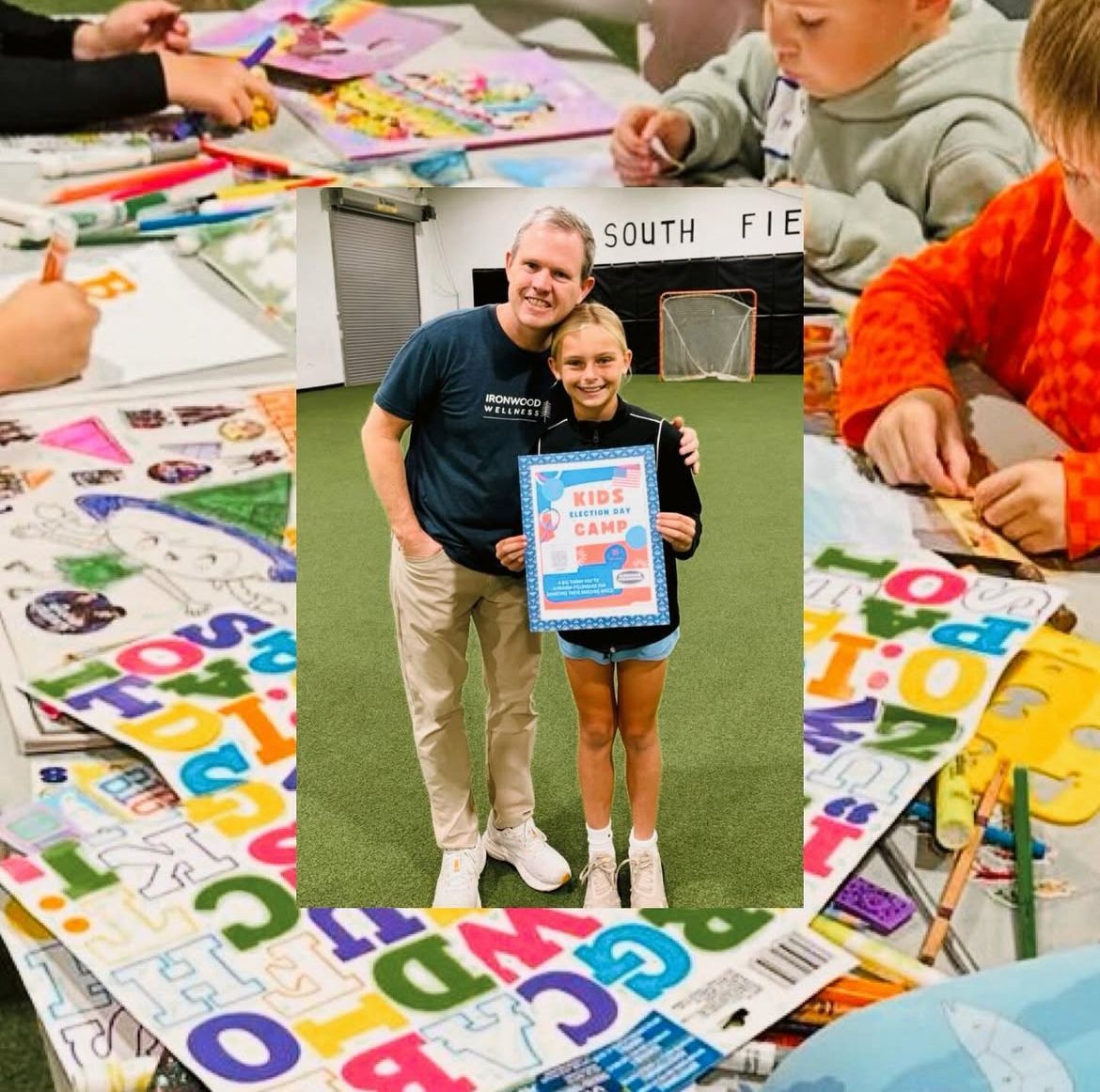 Volunteers and children painting colorful letter signs at a community craft table