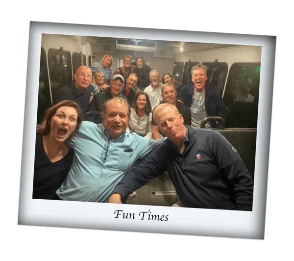 Group of smiling people seated together in a tilted photo frame labeled “Fun Times.”