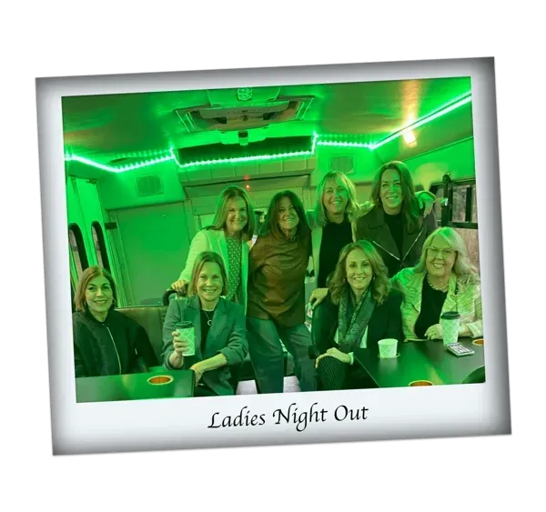 Group of friends posing in a green-lit van, captioned “Ladies Night Out.”