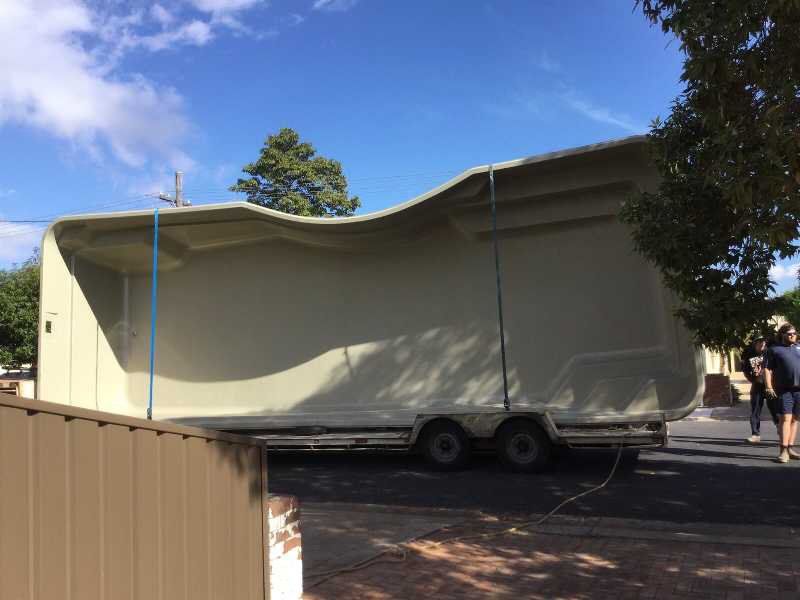 Pool Shell Being Transported On Truck — Pool and Landscaping in Dubbo, NSW