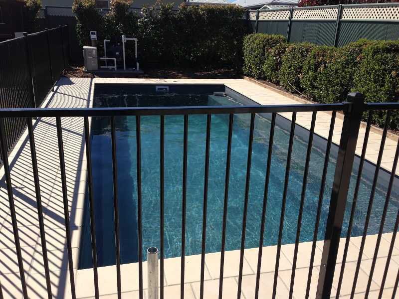Black Fence Around Perimeter of Pool — Pool and Landscaping in Dubbo, NSW